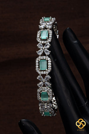 Diamond pattern with pastel green stone