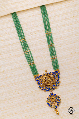 Four liner green beads with lakshmi Pendant - Sapphire blue