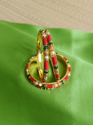 Coral, pearl and emerald green bangles