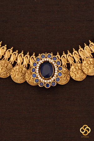 Lakshmi kasumalai with a sapphire blue mogappu