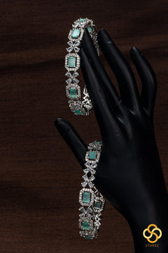 Diamond pattern with pastel green stone