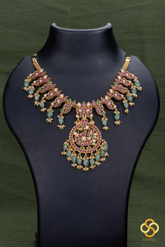 Jadau Kundan with Mayil Pendent Necklace - Ruby Red with Green Beads