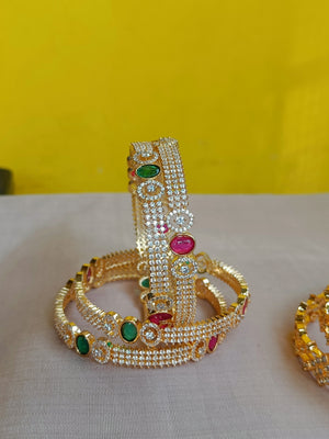 Zircon bangles with kemp and green interludes