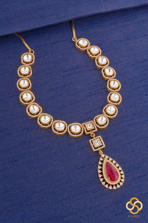 Kundan necklace set with ruby red centerpiece