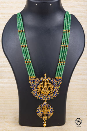 Four liner green beads with lakshmi Pendant - Sapphire blue
