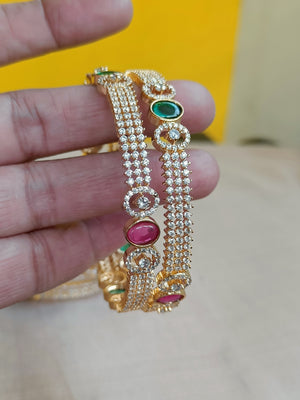 Zircon bangles with kemp and green interludes
