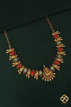 Lakshmi pendant with coral and green stones
