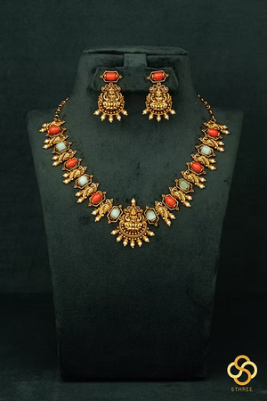 Lakshmi pendant with coral and green stones