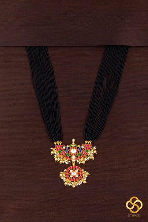 A bunch of black cut-beads strands - Mayurakanthi haram -Ruby red