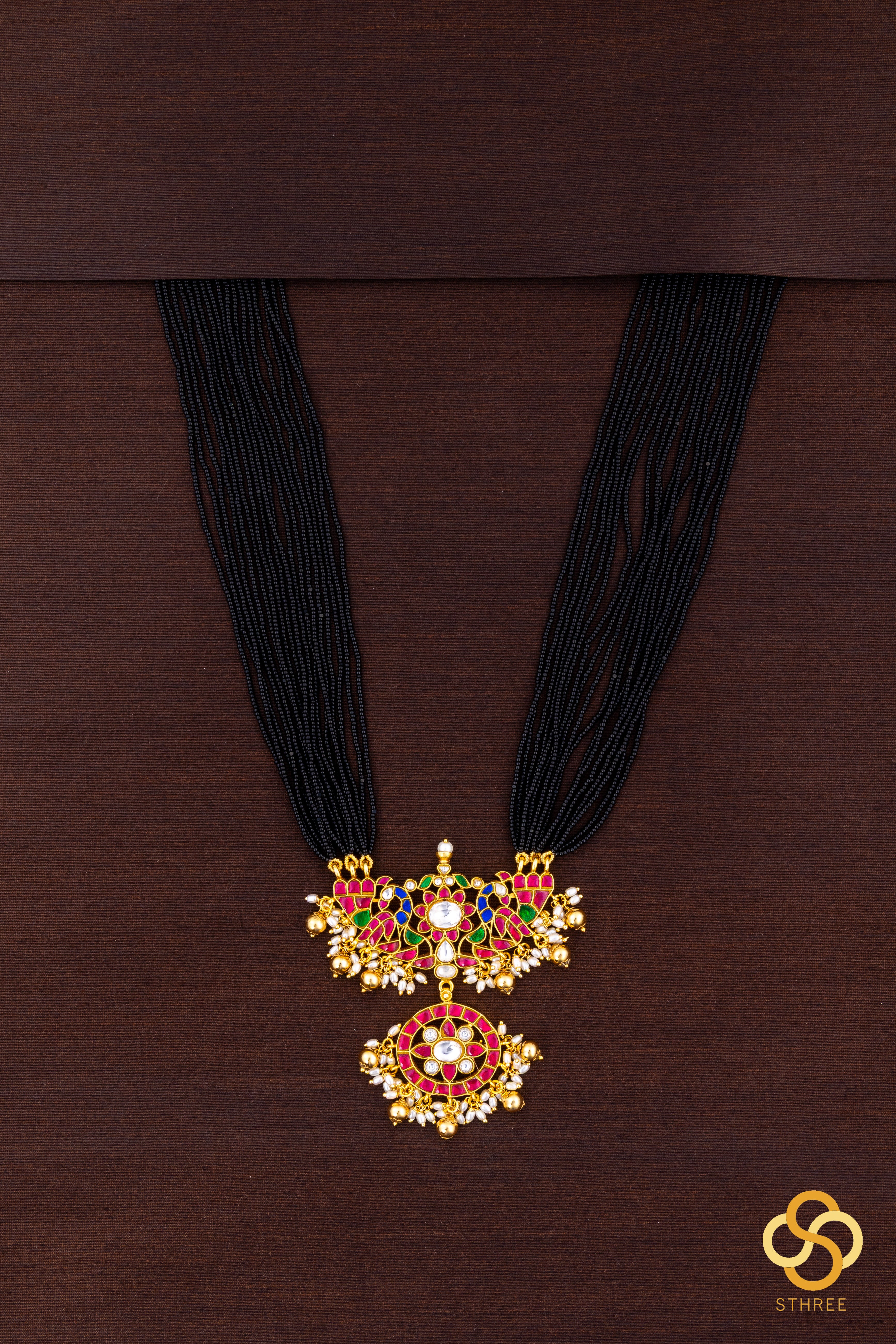 A bunch of black cut-beads strands - Mayurakanthi haram -Ruby red