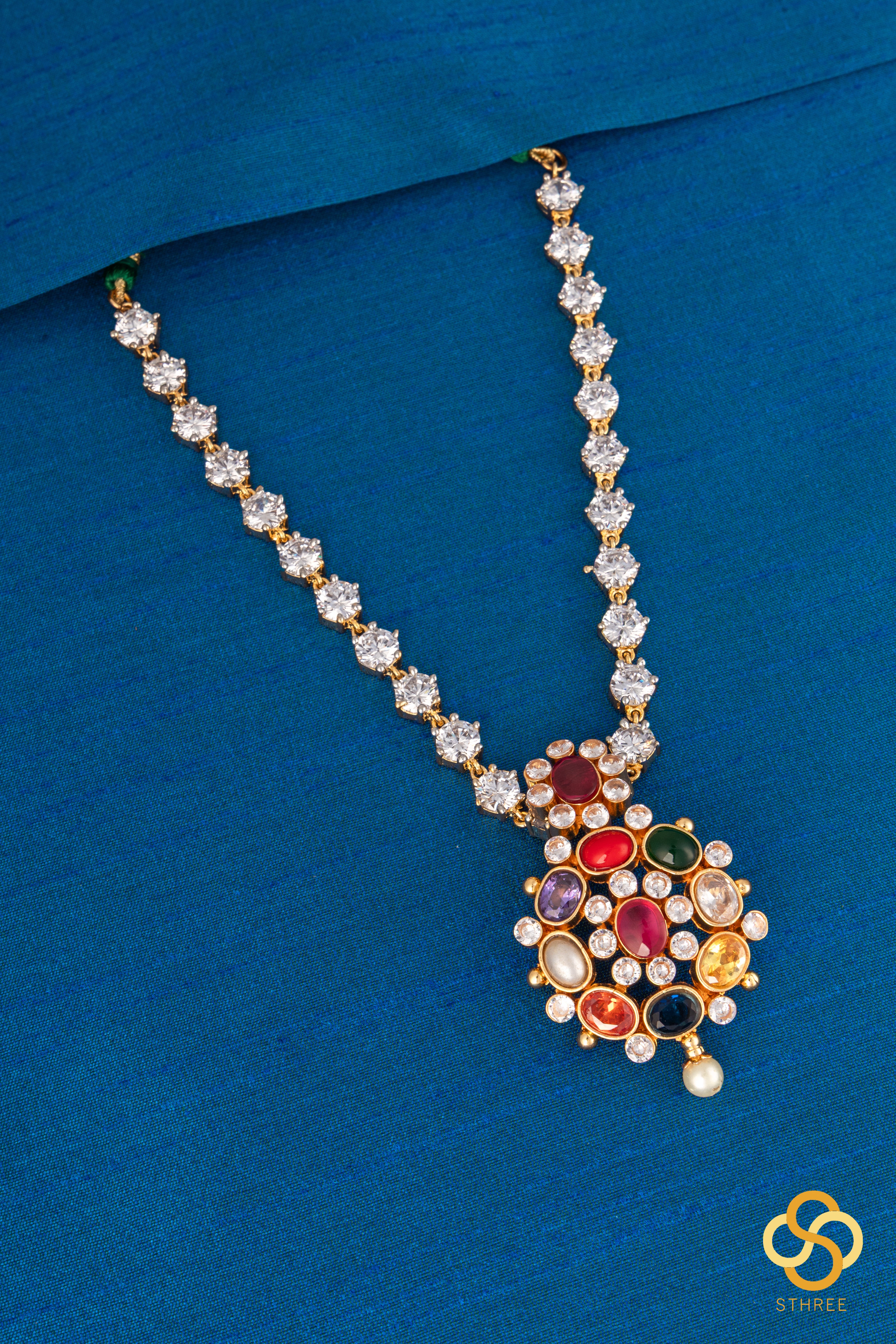 Navarathna pendant in a zircon chain