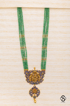Four liner green beads with lakshmi Pendant - Sapphire blue