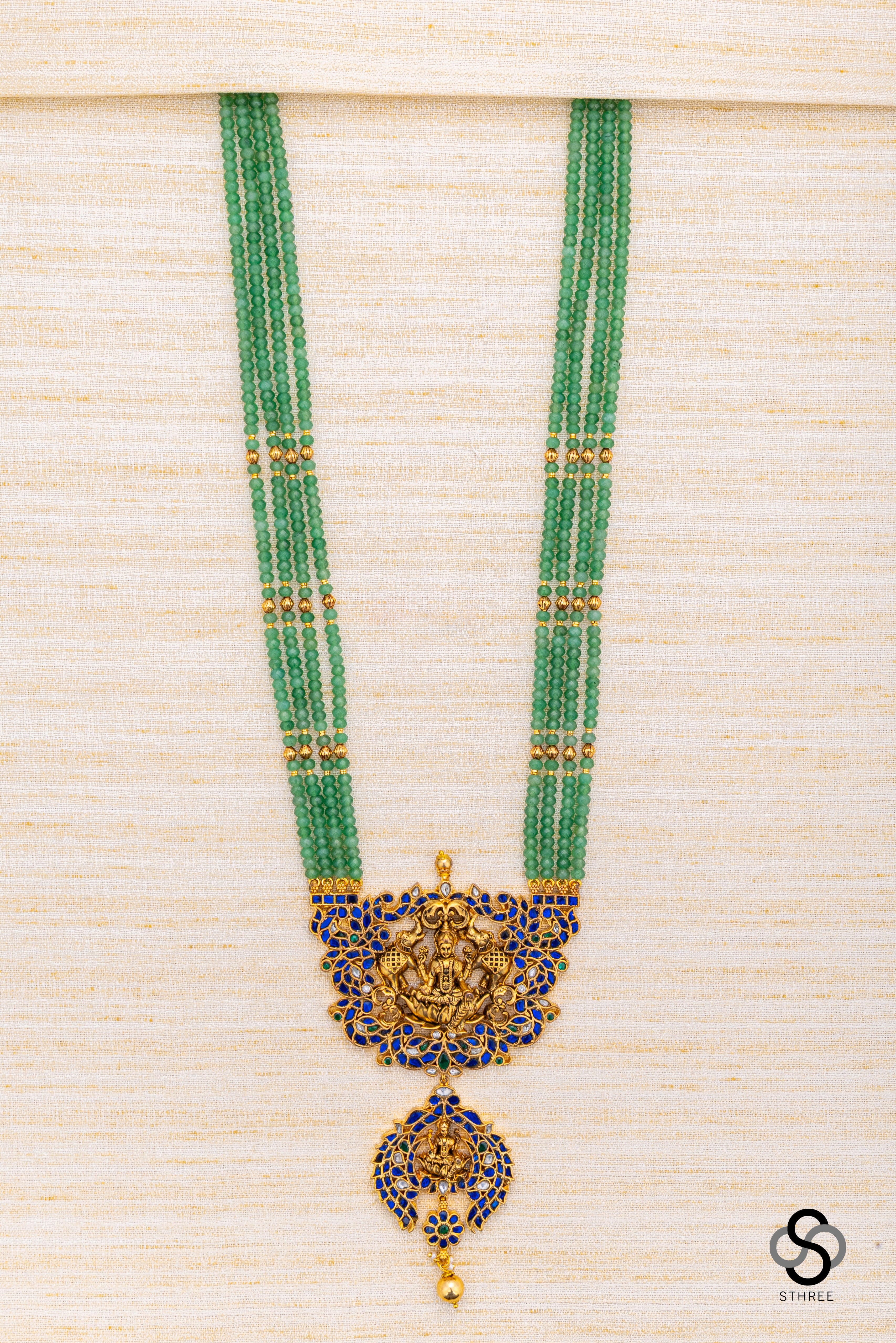 Four liner green beads with lakshmi Pendant - Sapphire blue