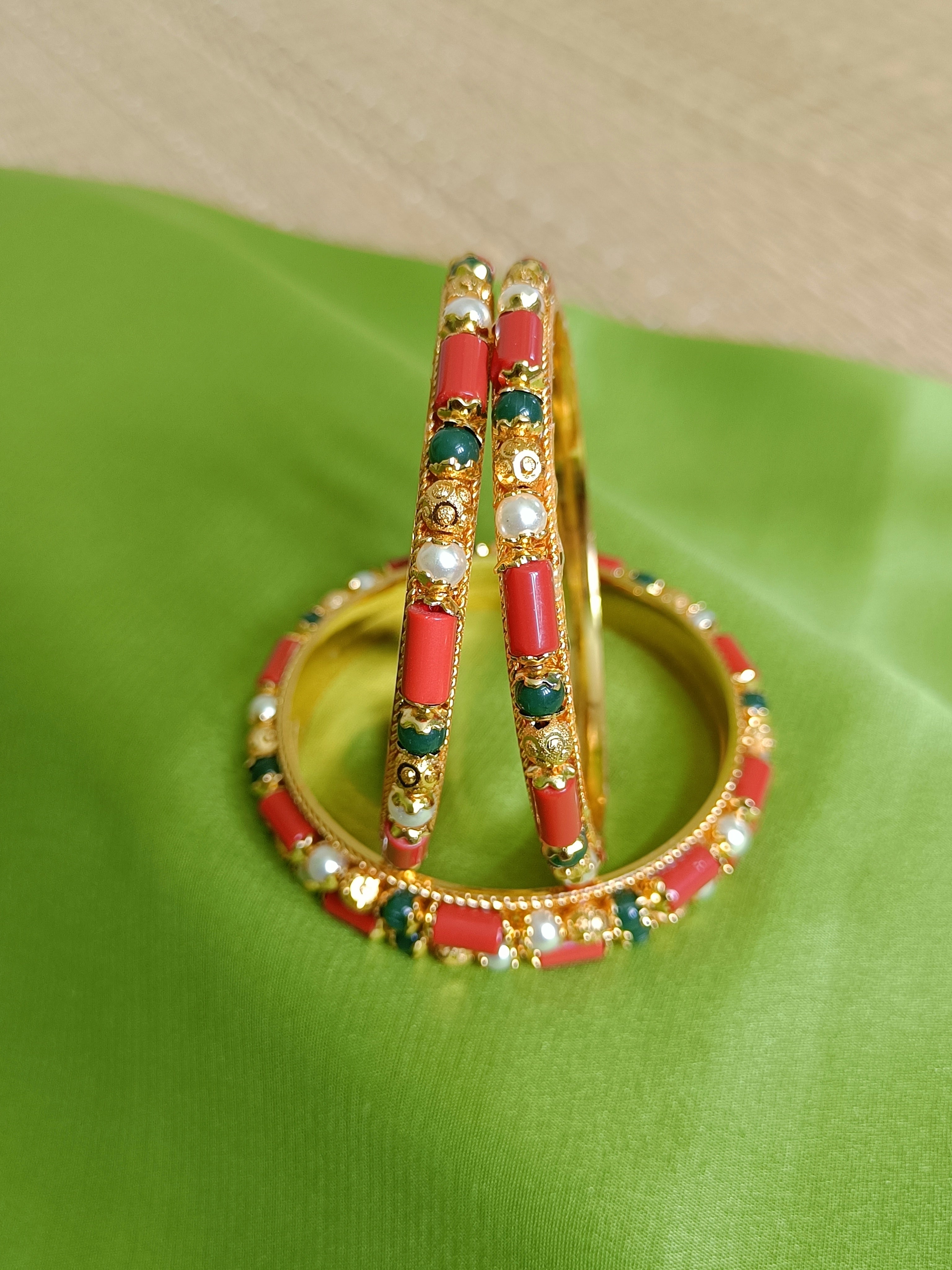 Coral, pearl and emerald green bangles