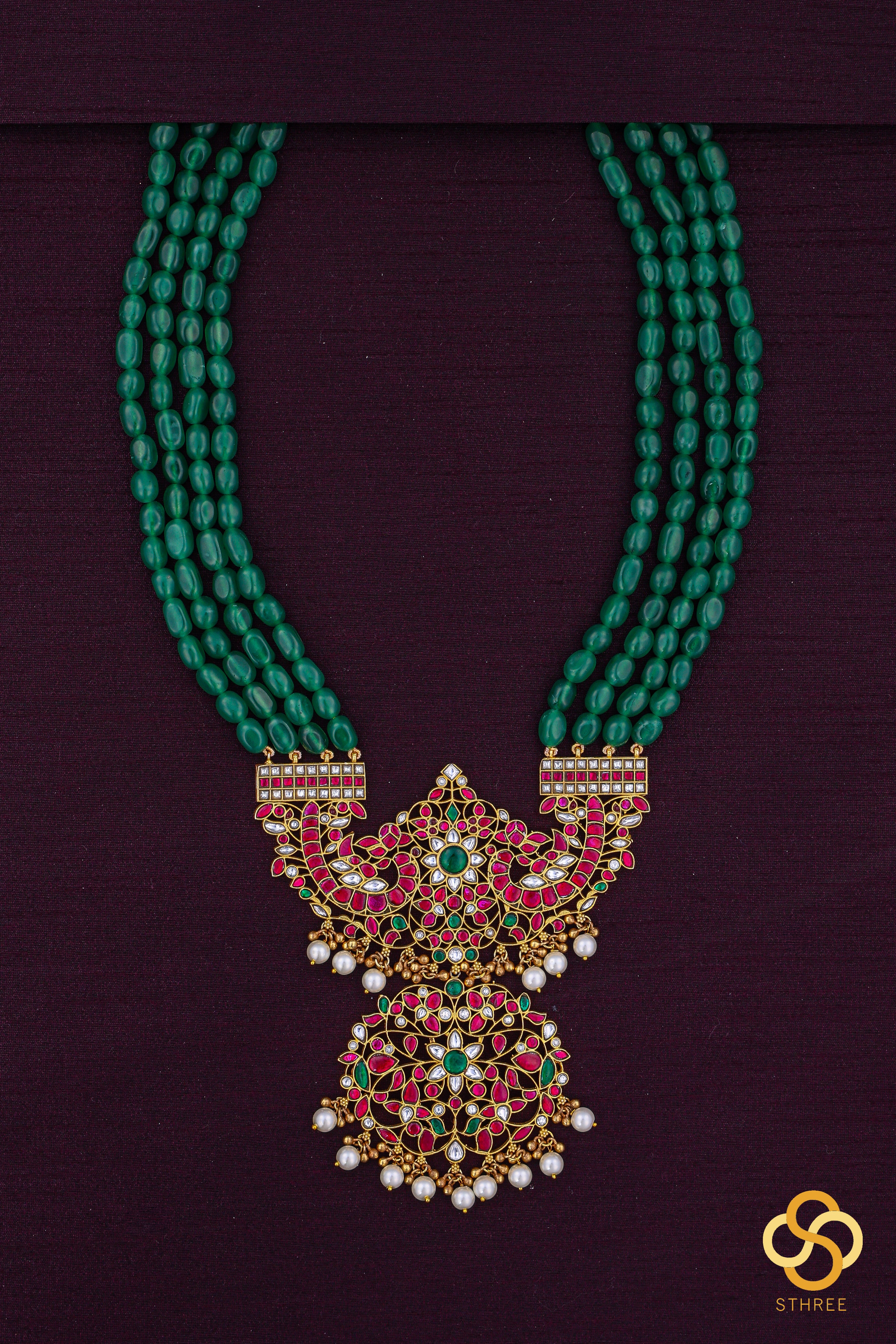 Makarakanthi pendant in four lines green beads