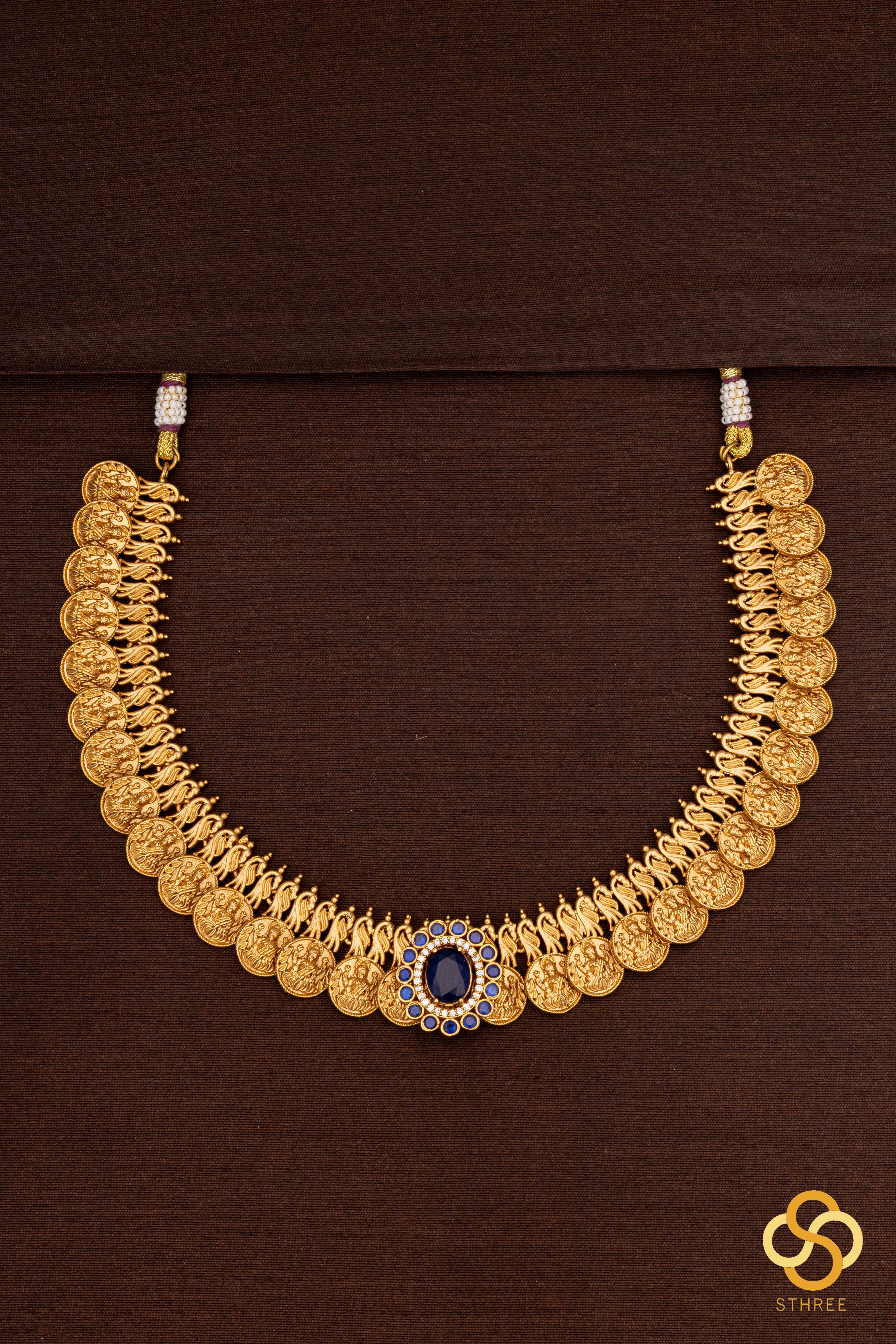 Lakshmi kasumalai with a sapphire blue  mogappu