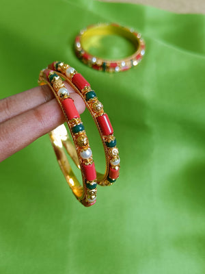 Coral, pearl and emerald green bangles