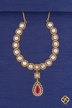 Kundan necklace set with ruby red centerpiece