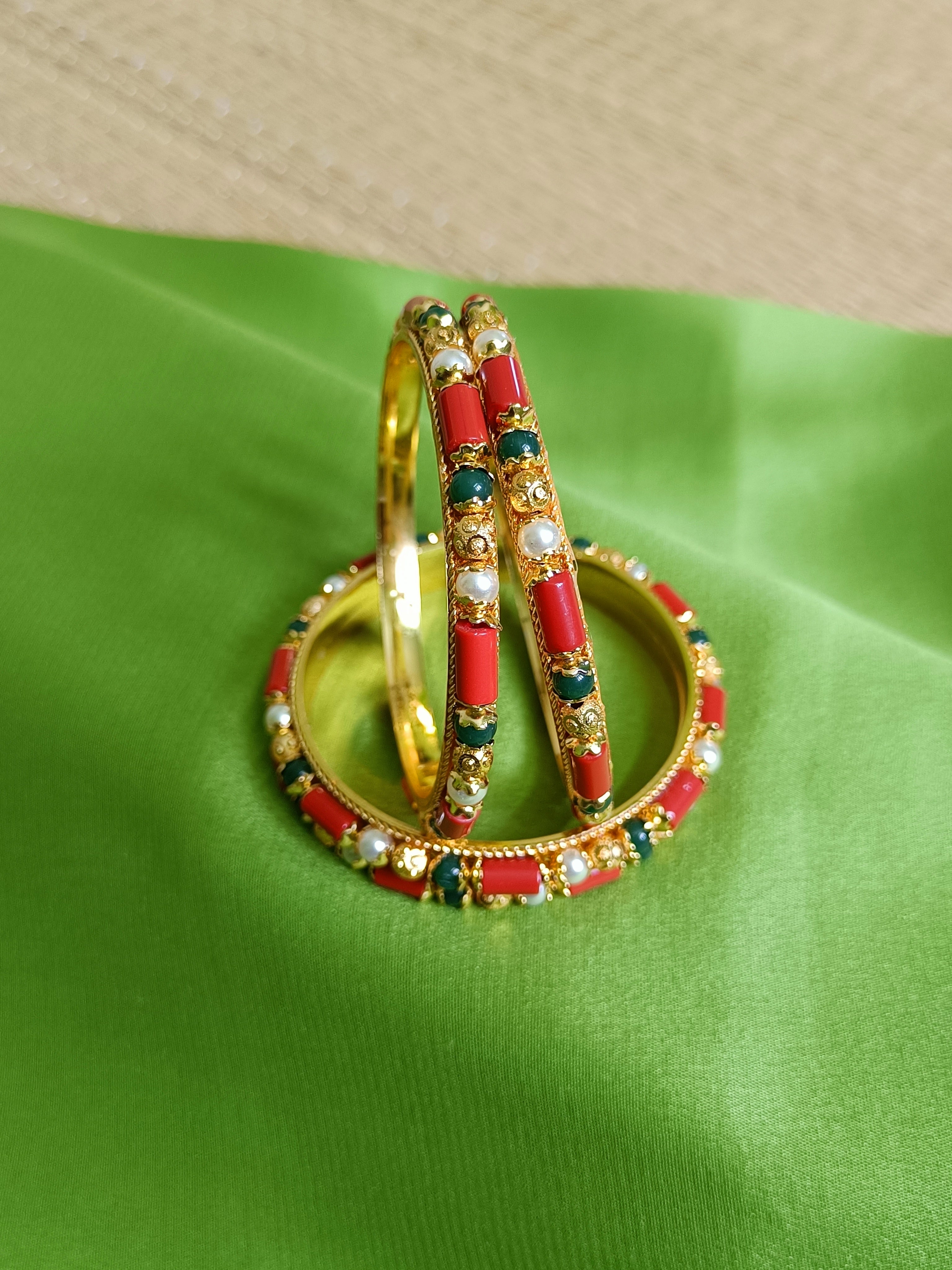 Coral, pearl and emerald green bangles