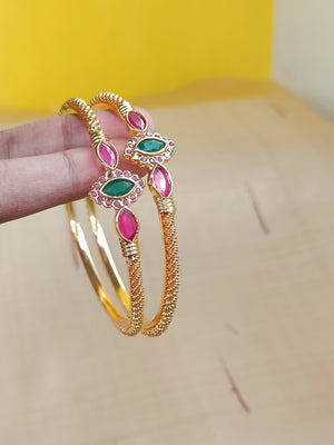 Gold kada with red and green stones