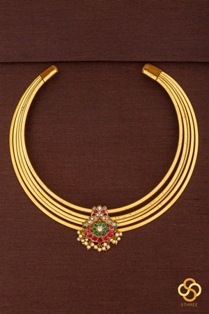 Hasli with jadau kundan with a red chandbali centrepiece