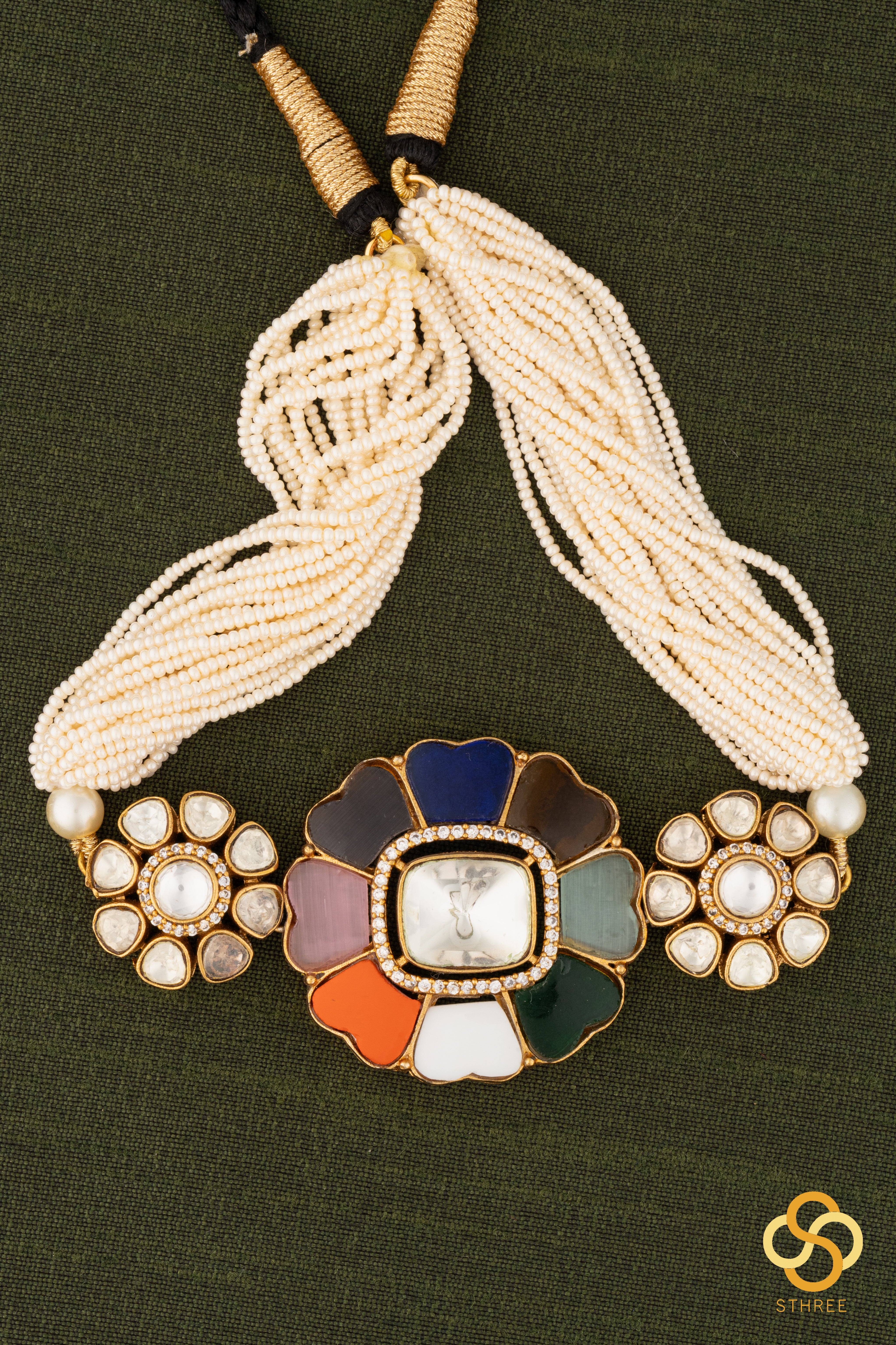 Navarathna and kundan pendant with a bunch of pearls