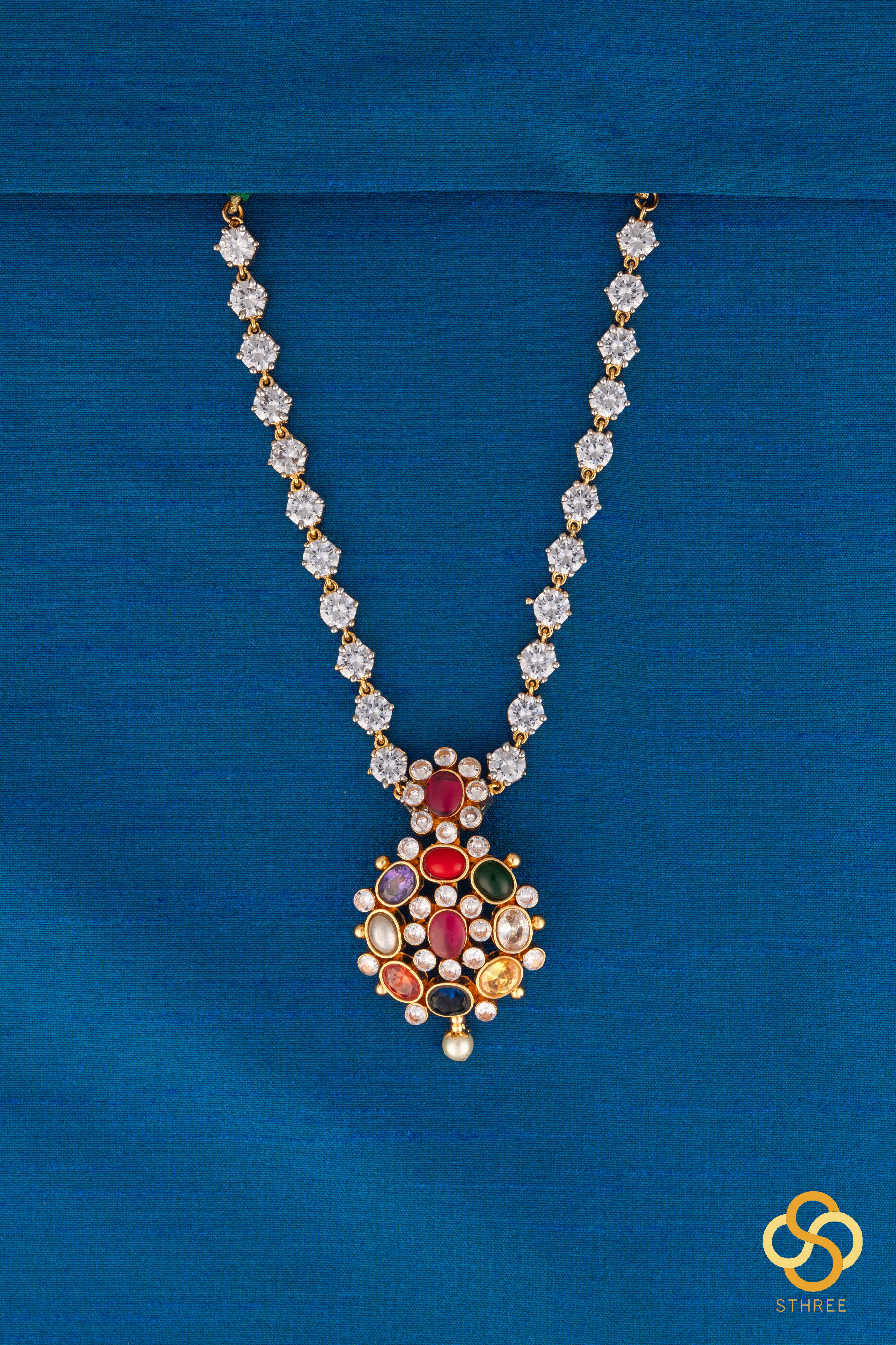 Navarathna pendant in a zircon chain