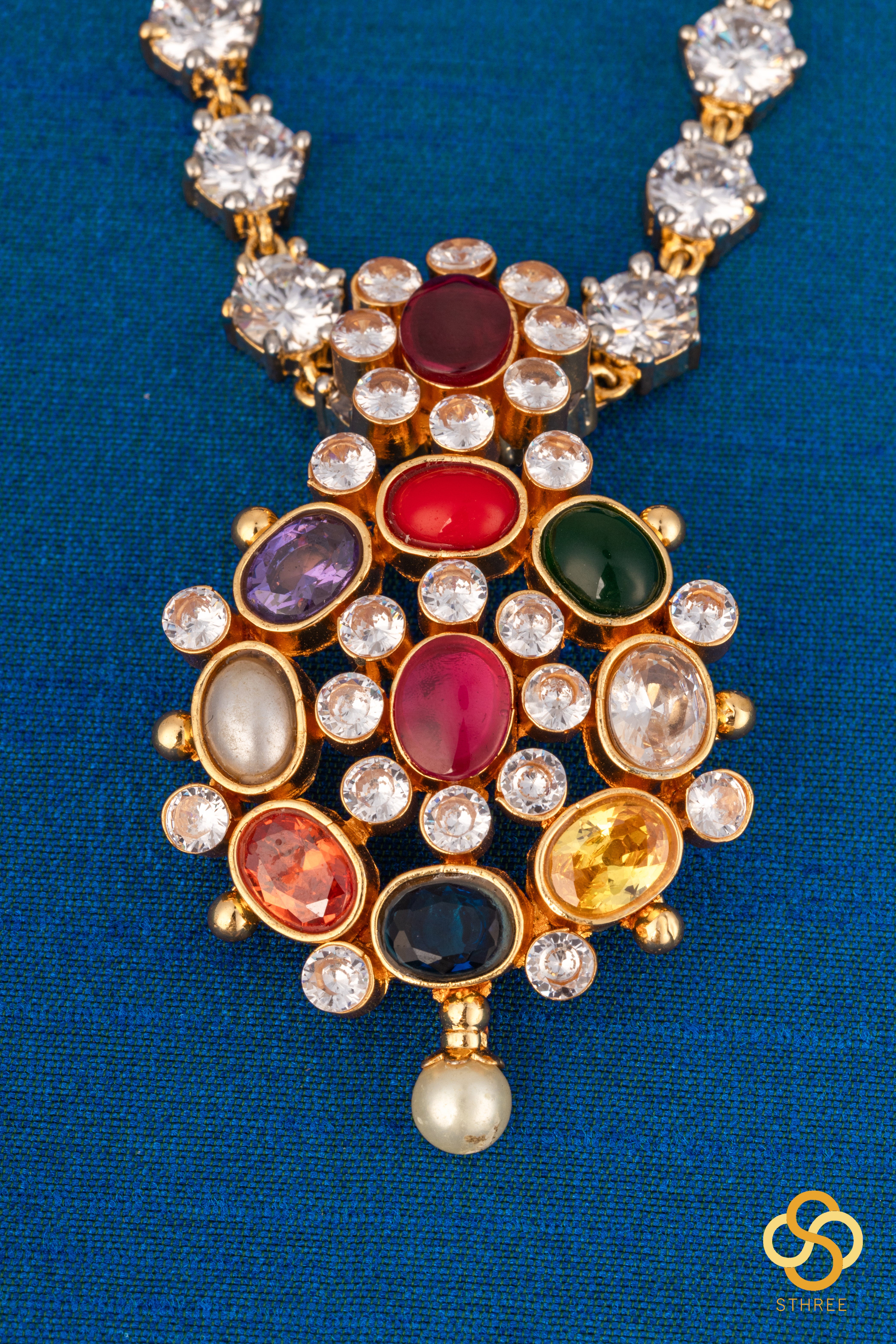 Navarathna pendant in a zircon chain