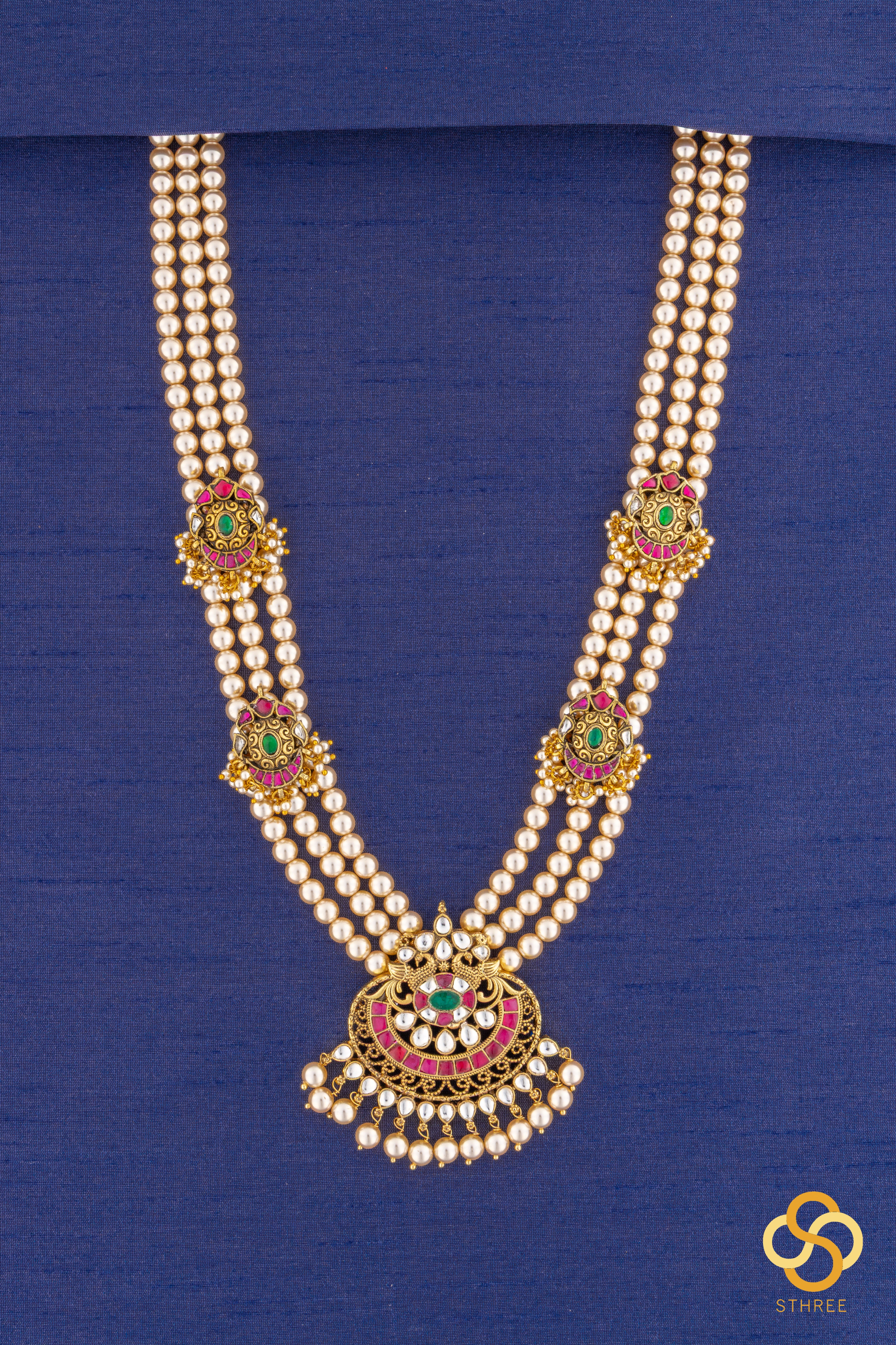 Swarovski three-liner pearls with a chandbali pendant and mogappu