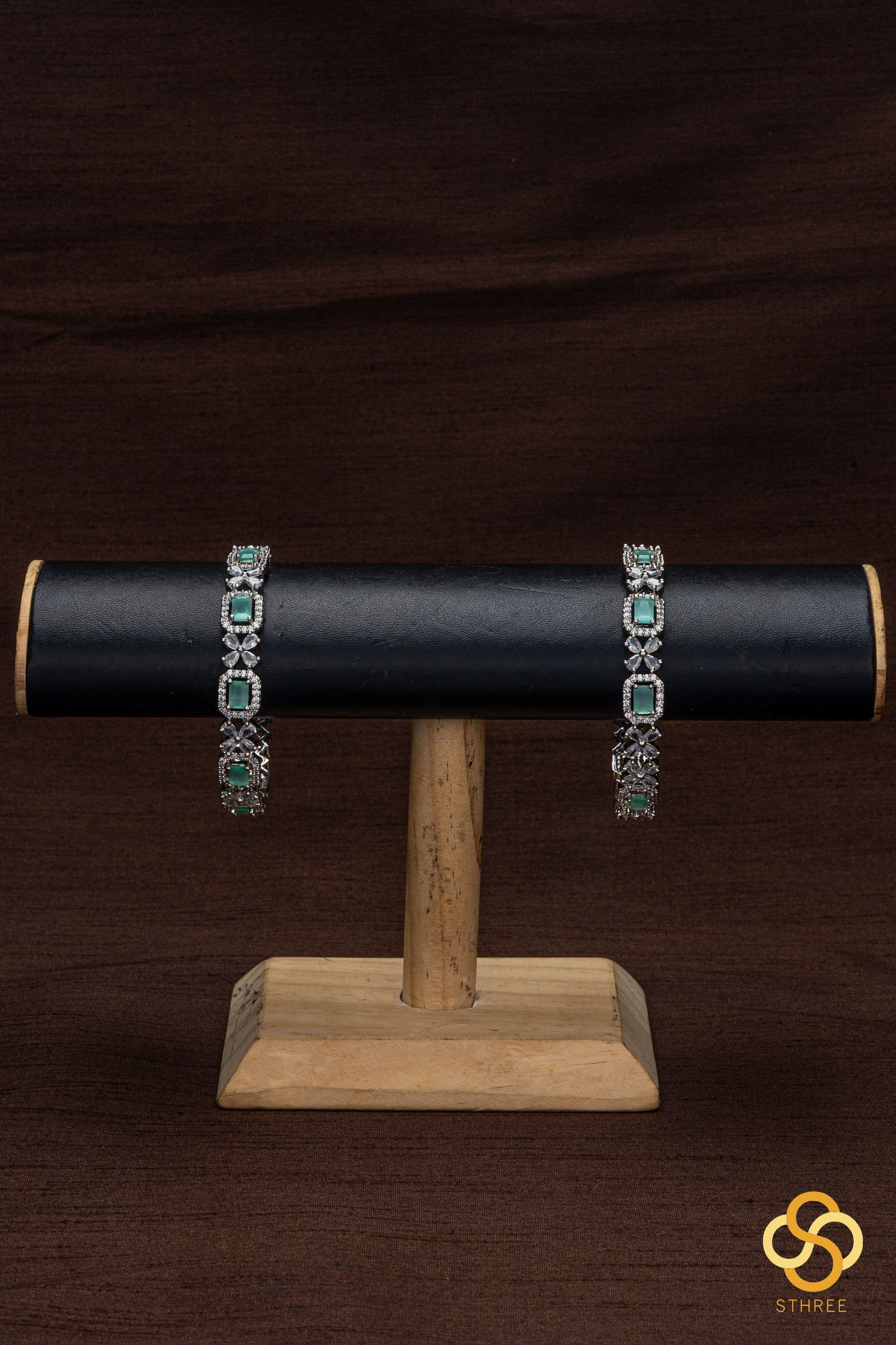 Diamond pattern with pastel green stone