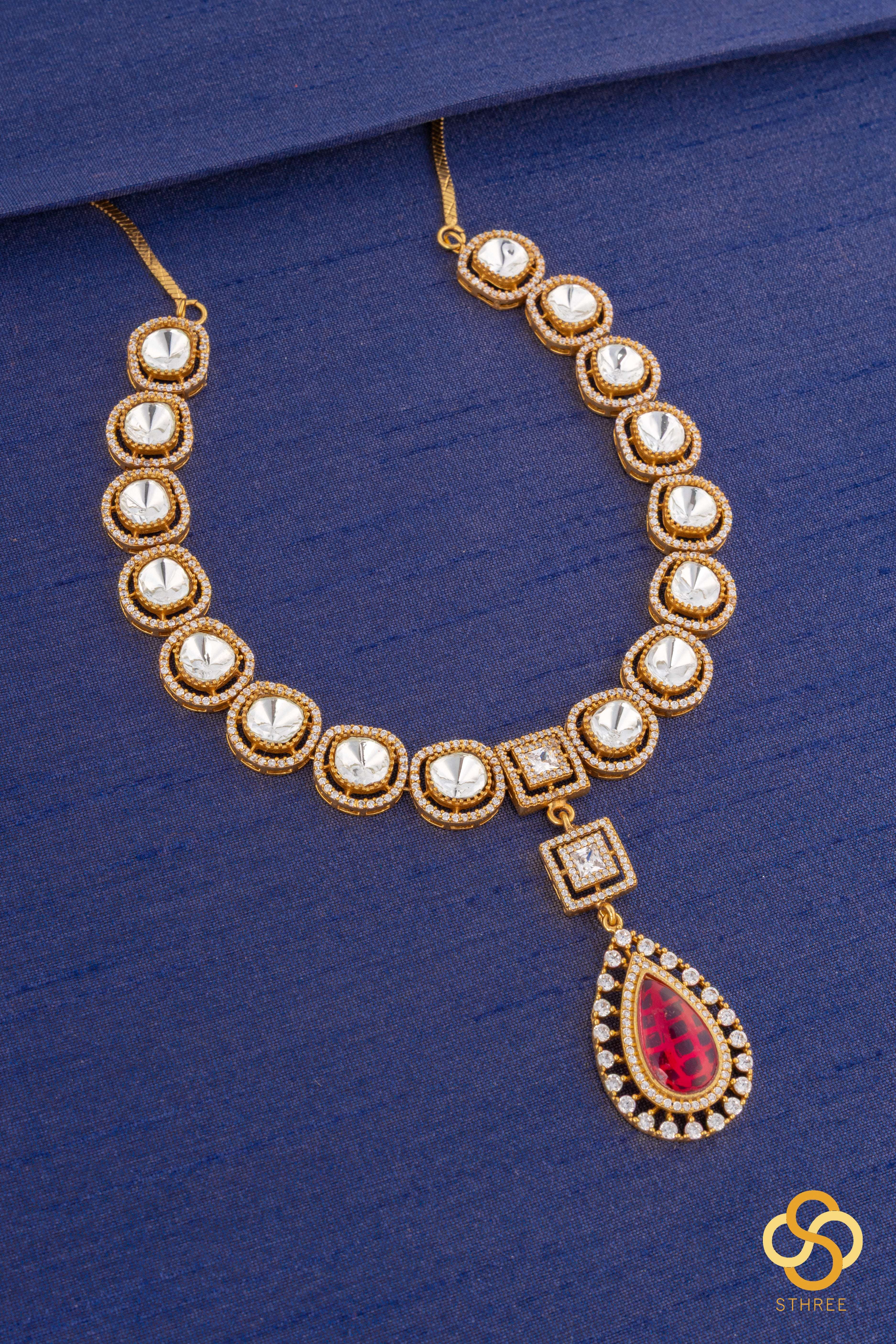 Kundan necklace set with ruby red centerpiece