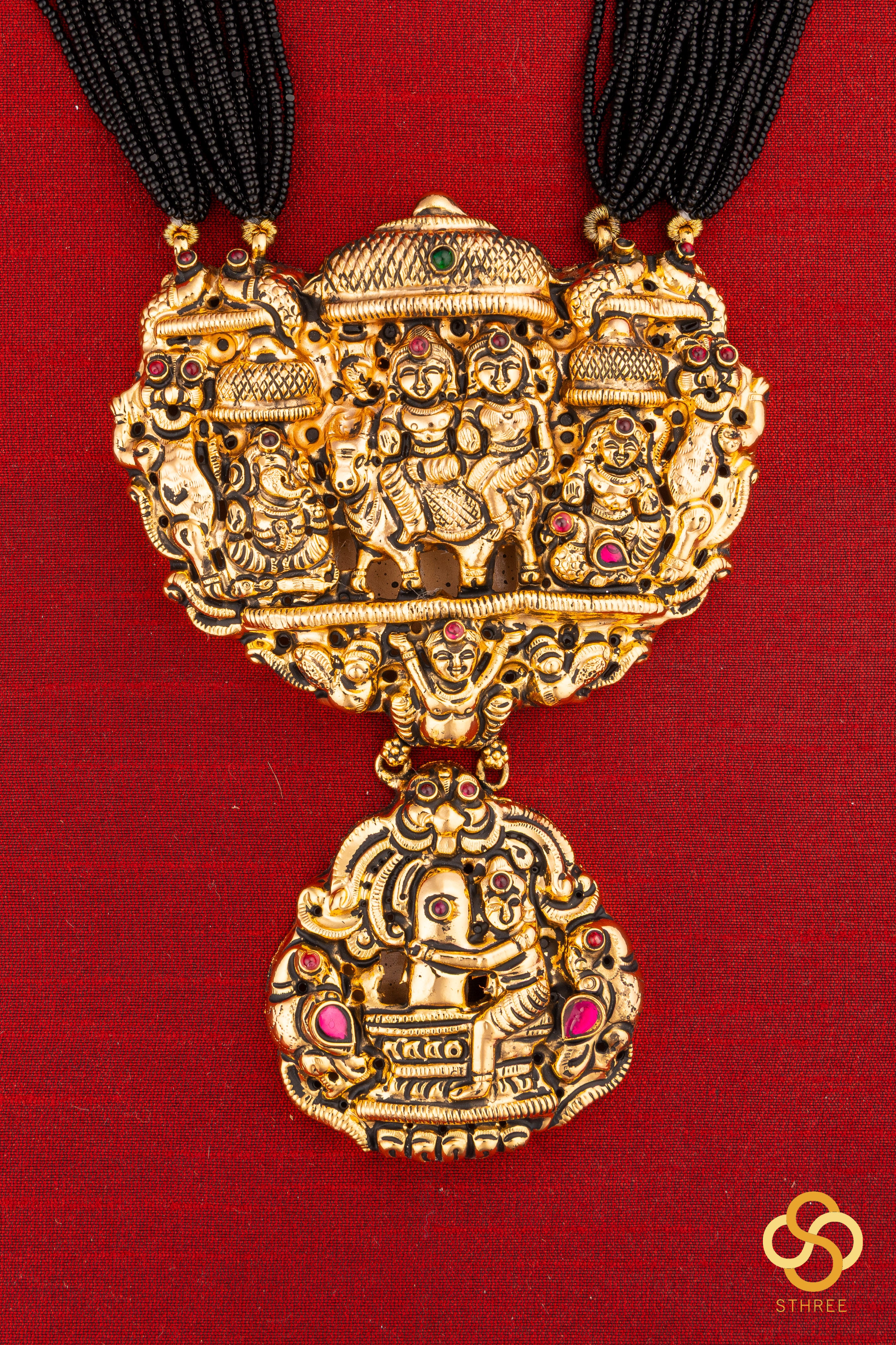 A bunch of black cut-beads strands - The Gowri Shankaram pendant