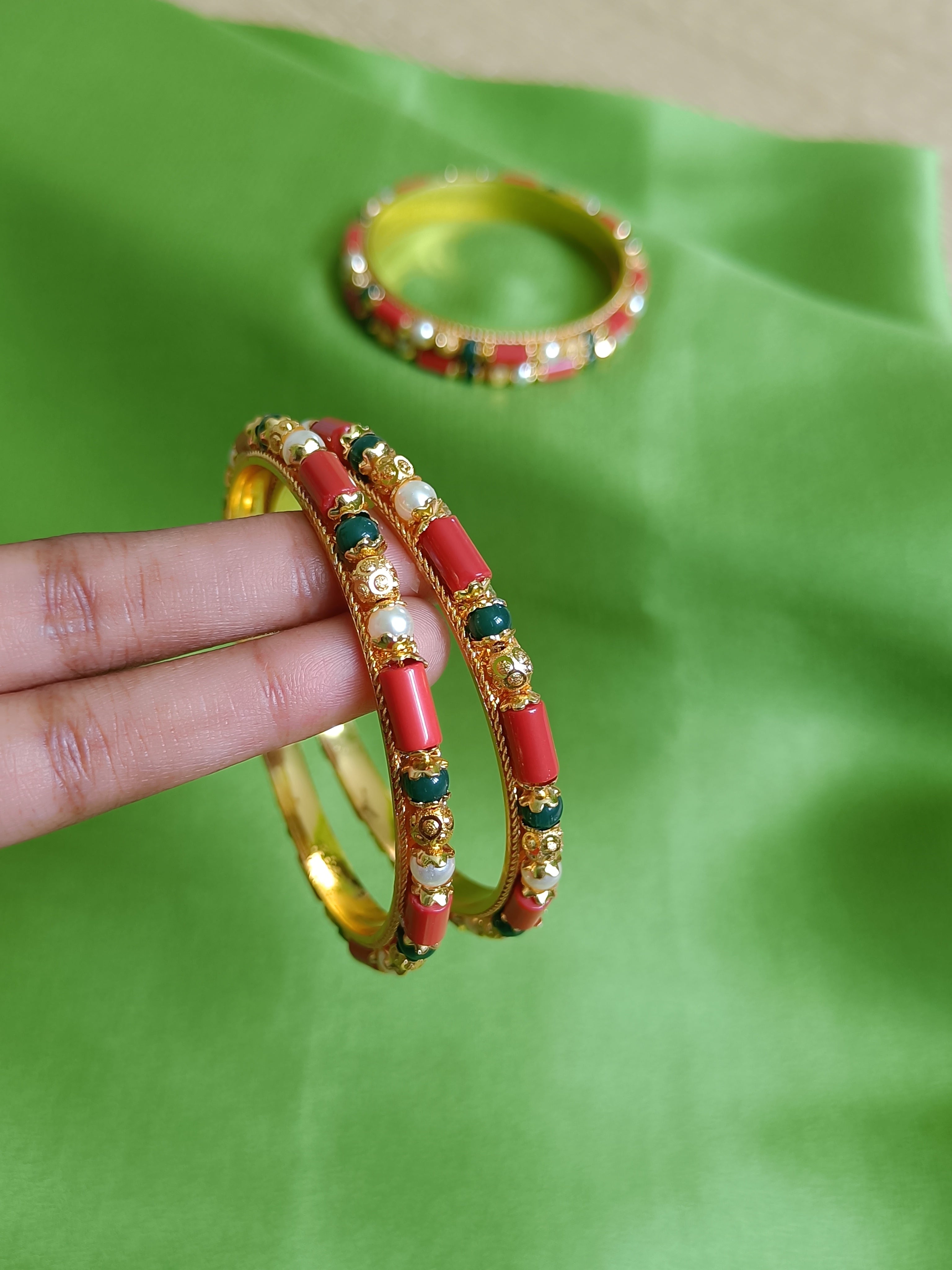 Coral, pearl and emerald green bangles