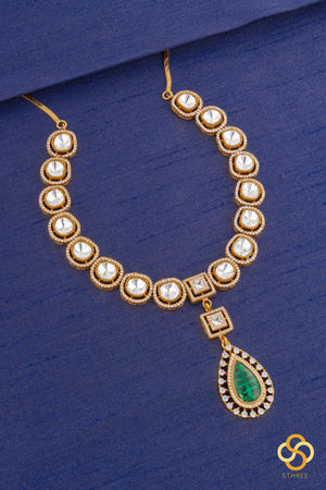 Kundan necklace set with emerald green centerpiece