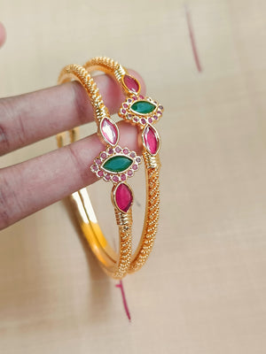 Gold kada with red and green stones