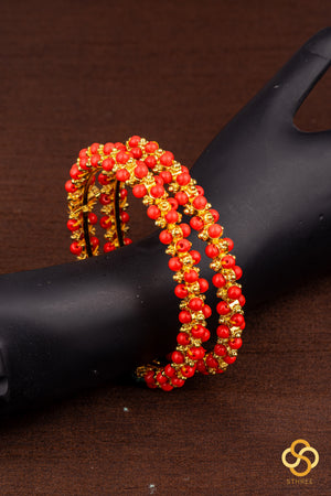Coral and gold ball kada