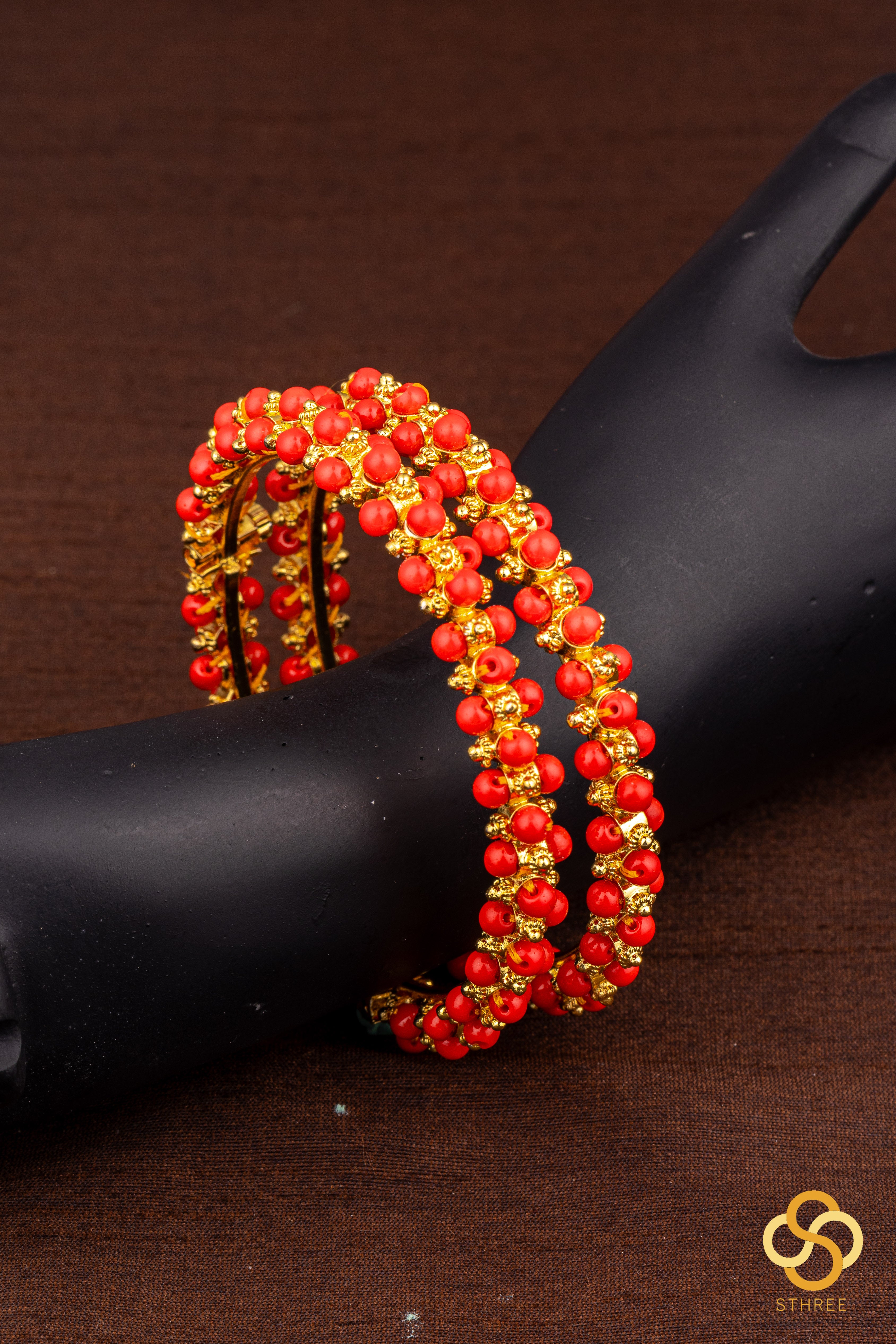 Coral and gold ball kada