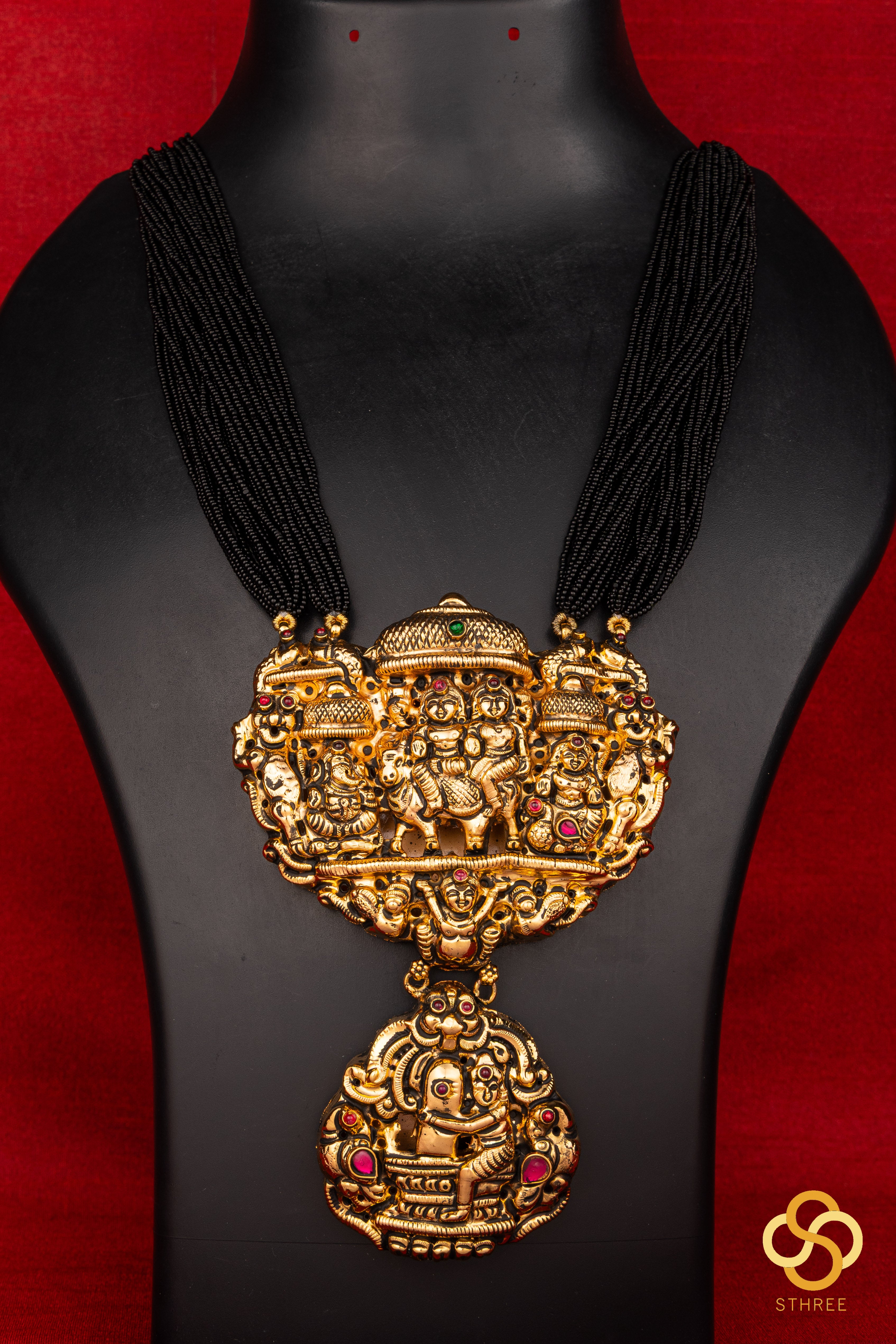 A bunch of black cut-beads strands - The Gowri Shankaram pendant