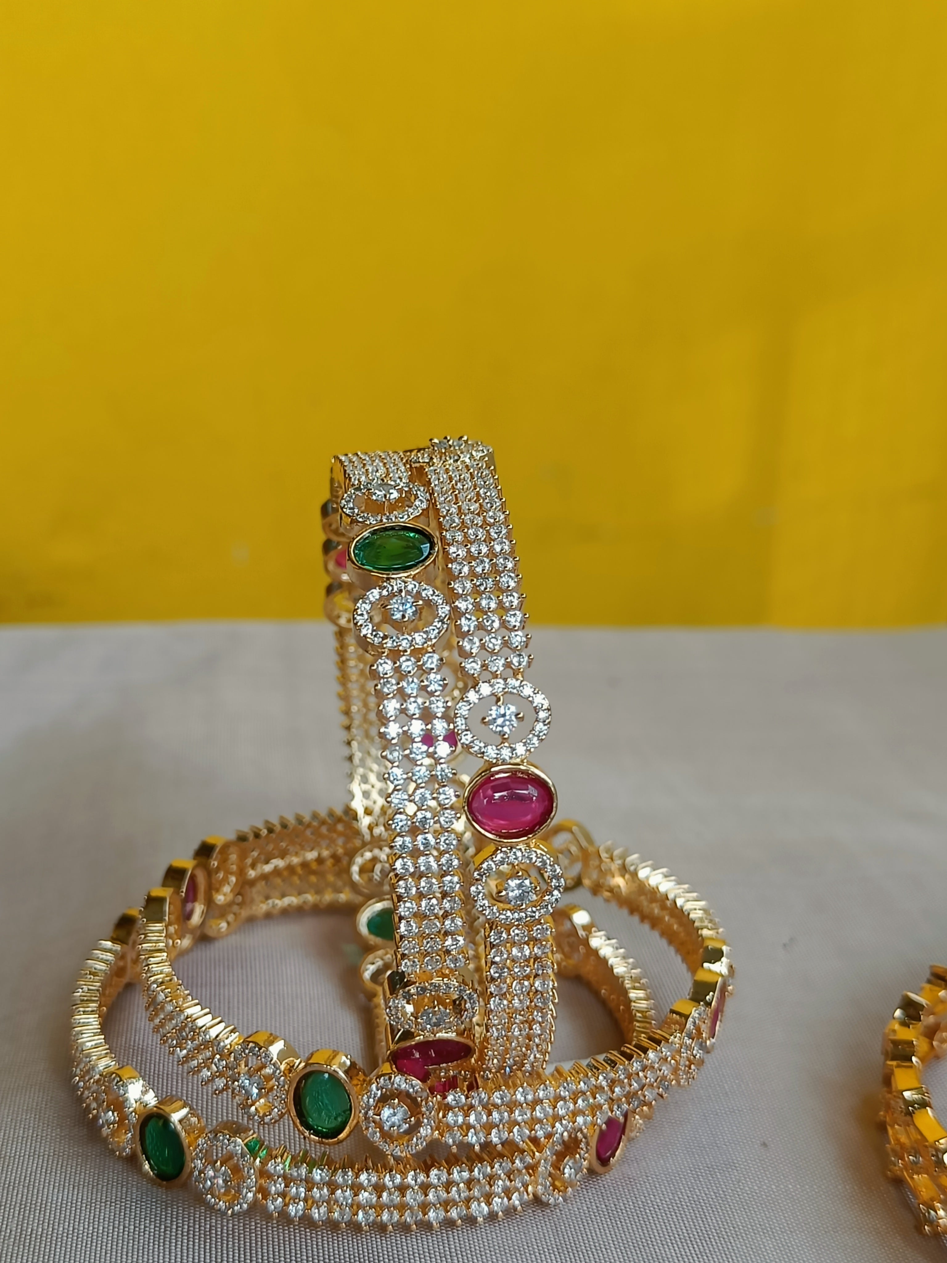 Zircon bangles with kemp and green interludes