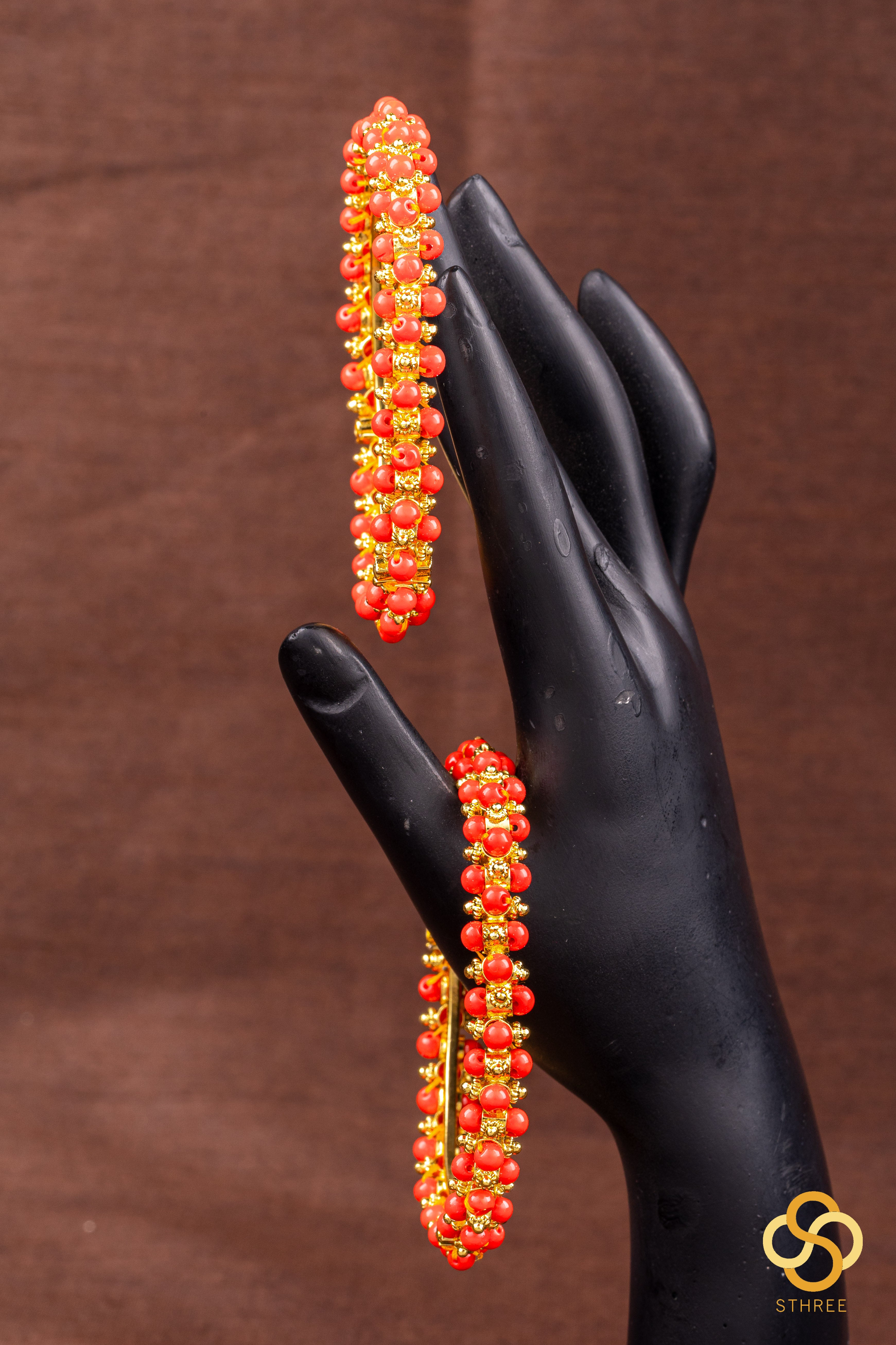 Coral and gold ball kada