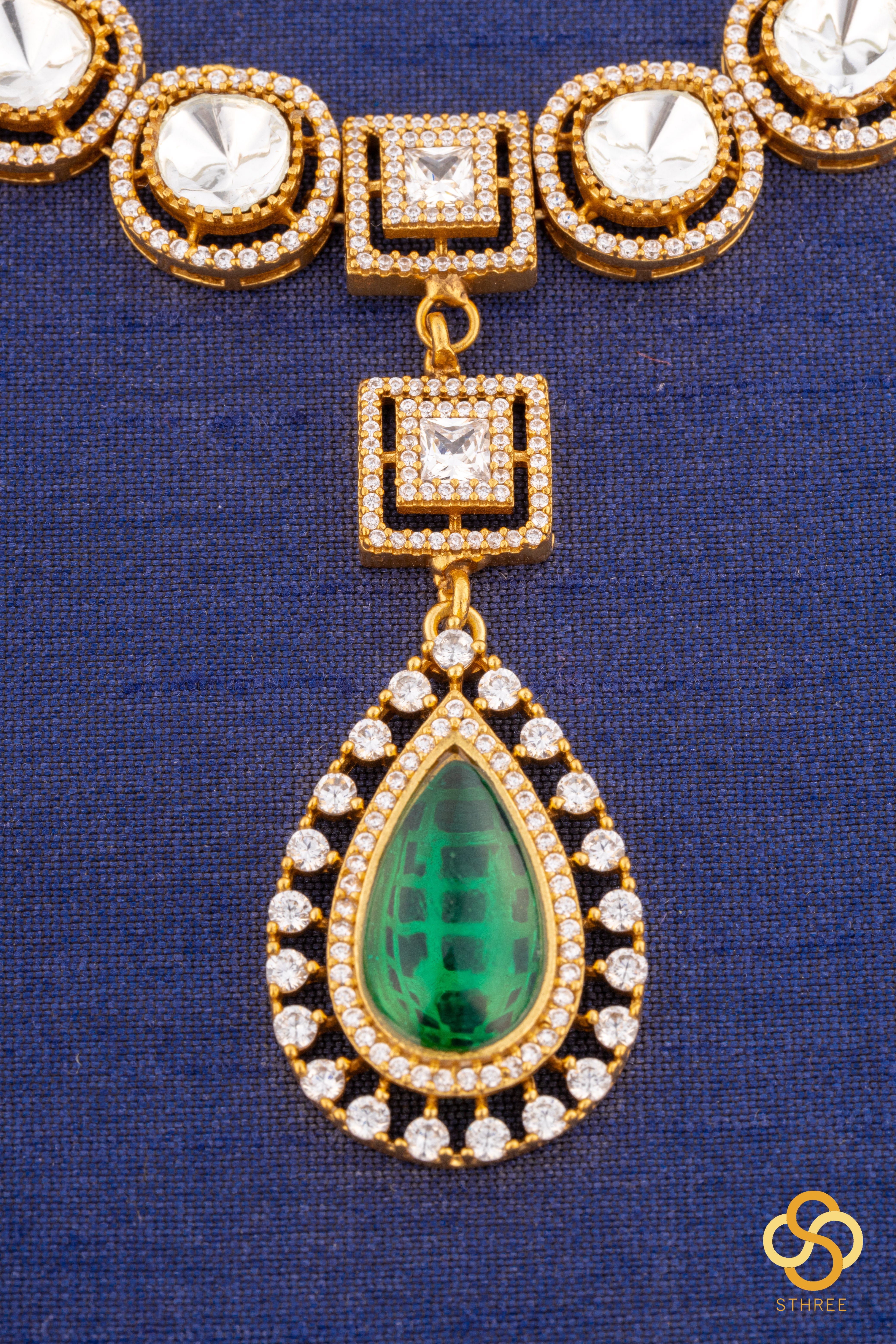 Kundan necklace set with emerald green centerpiece
