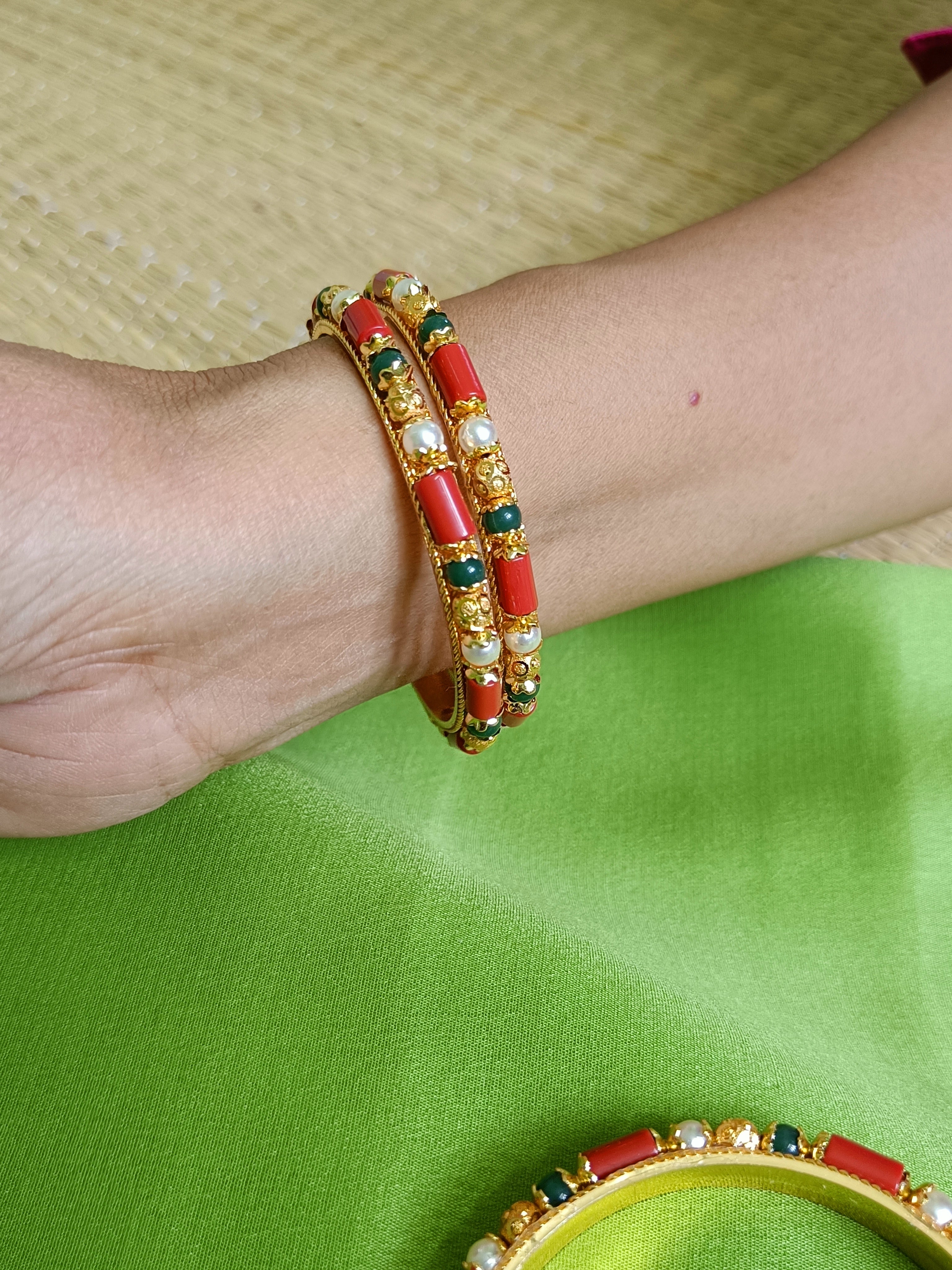 Coral, pearl and emerald green bangles