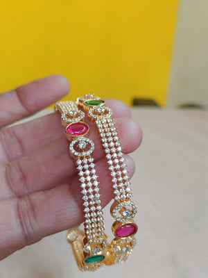 Zircon bangles with kemp and green interludes