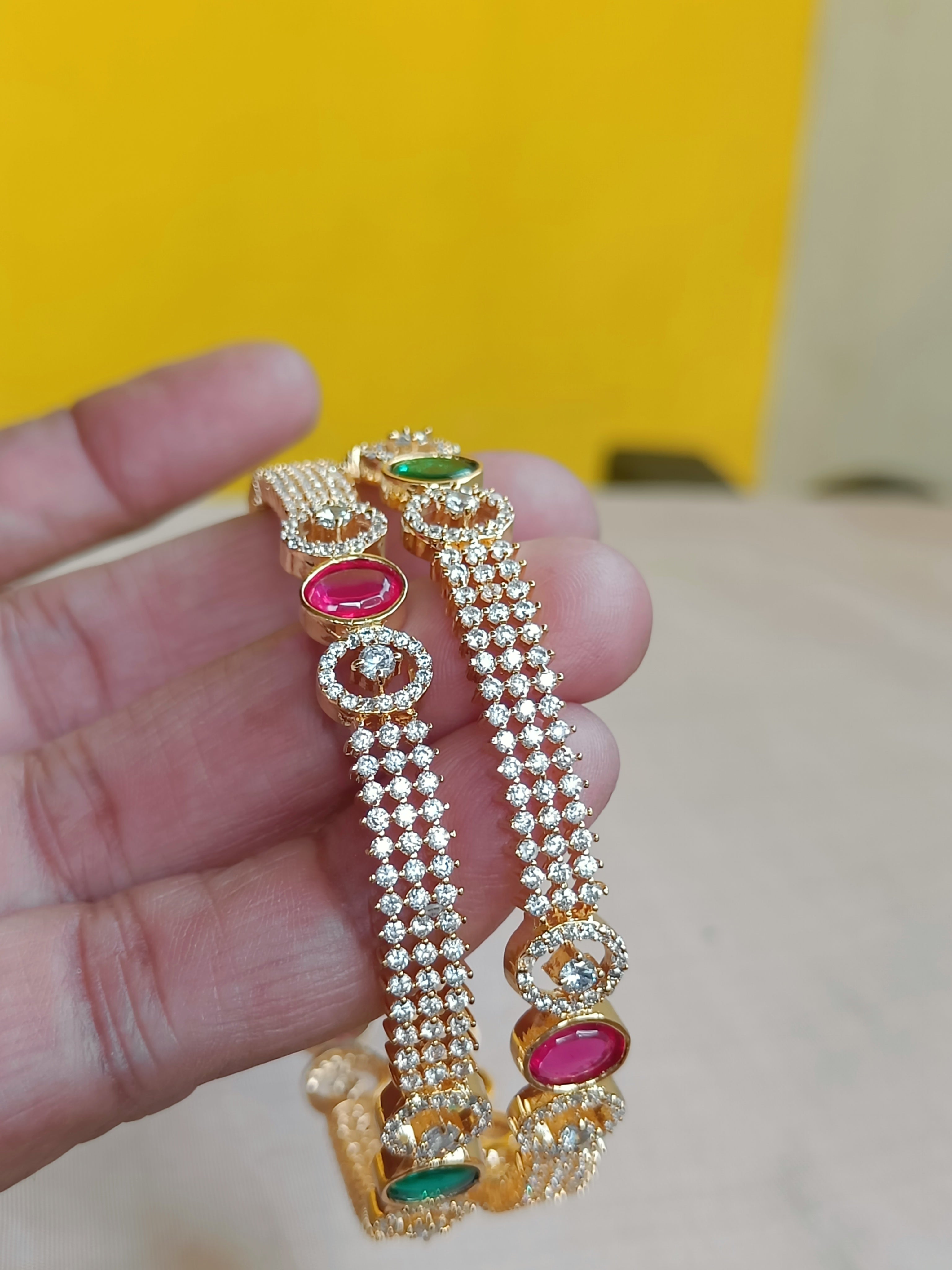Zircon bangles with kemp and green interludes