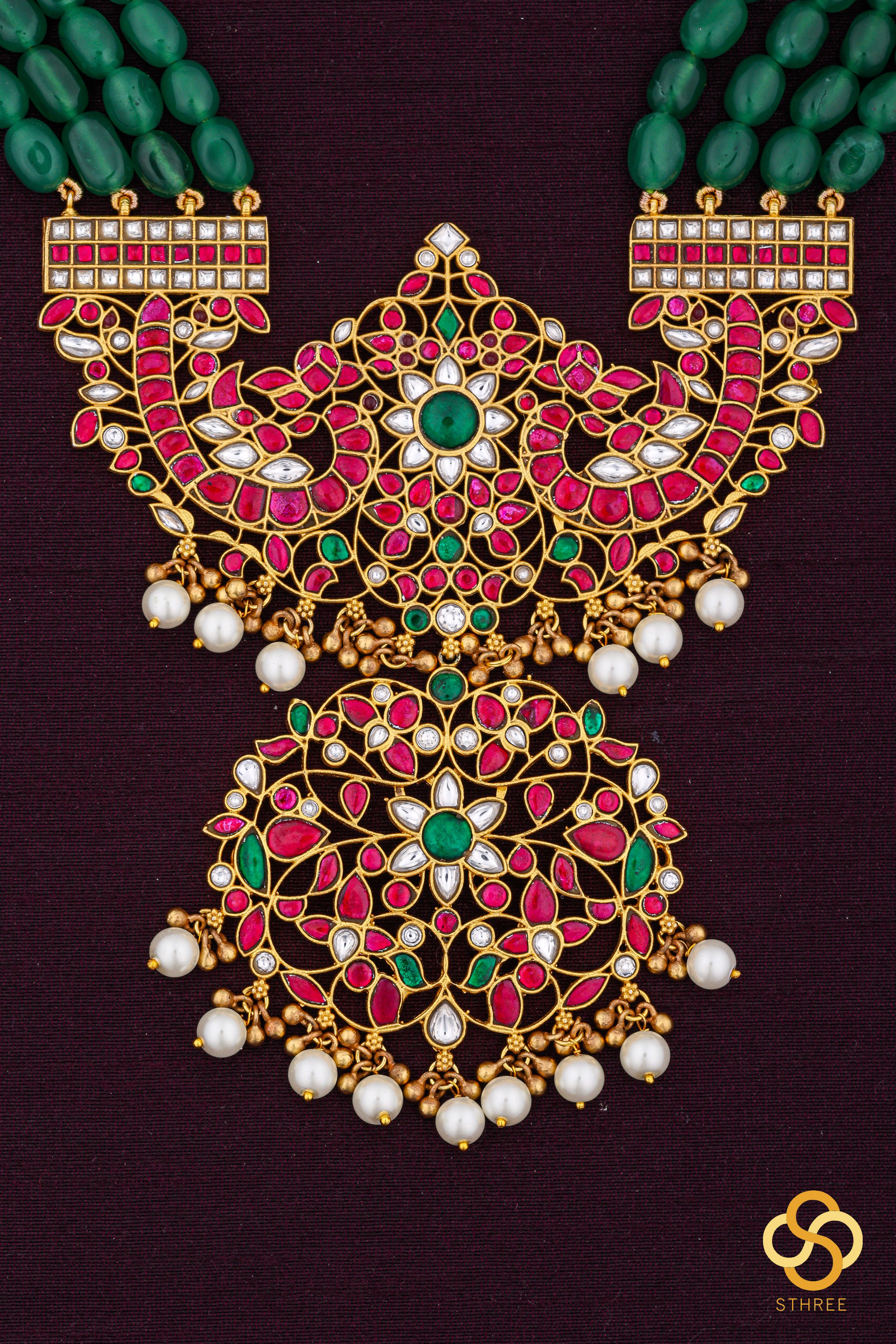 Makarakanthi pendant in four lines green beads