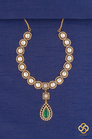 Kundan necklace set with emerald green centerpiece