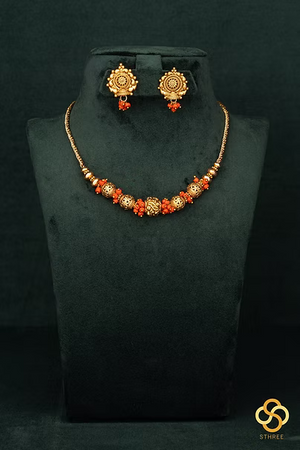 Coral beads with Gold ball