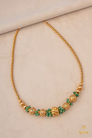 Green beads with Gold ball