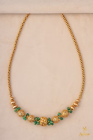 Green beads with Gold ball