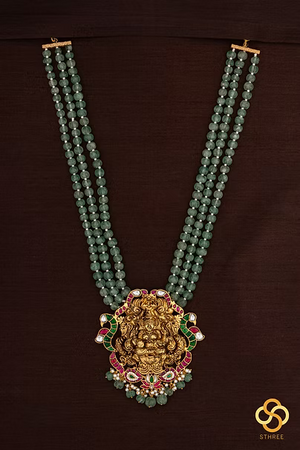 Lakshmi pendant in three liner green beads
